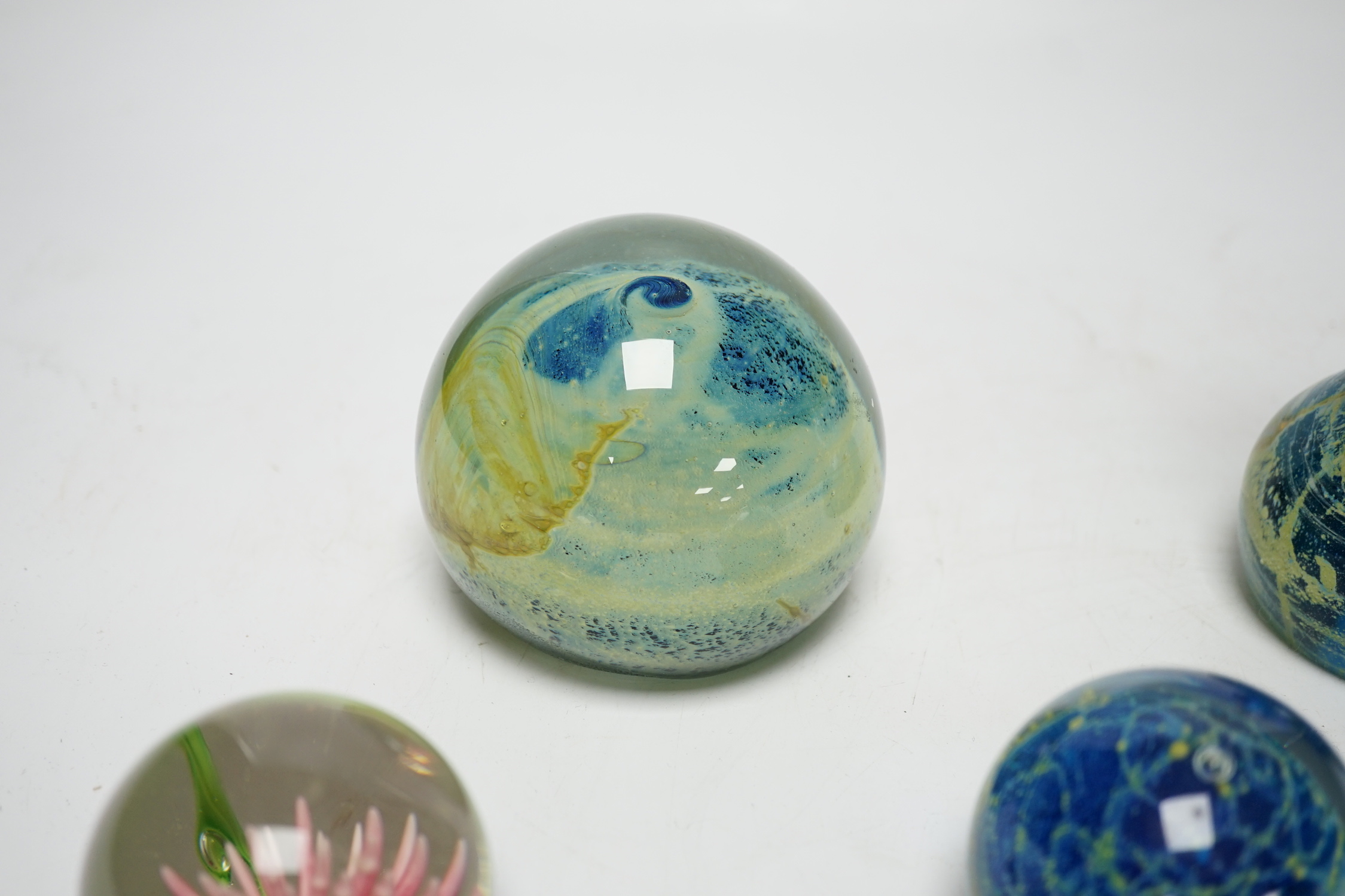 Three Mdina style glass paperweights and a Chinese paperweight (4)